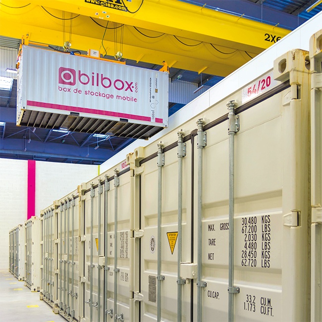 Déplacement container abilbox avec grue dans l'entrepôt